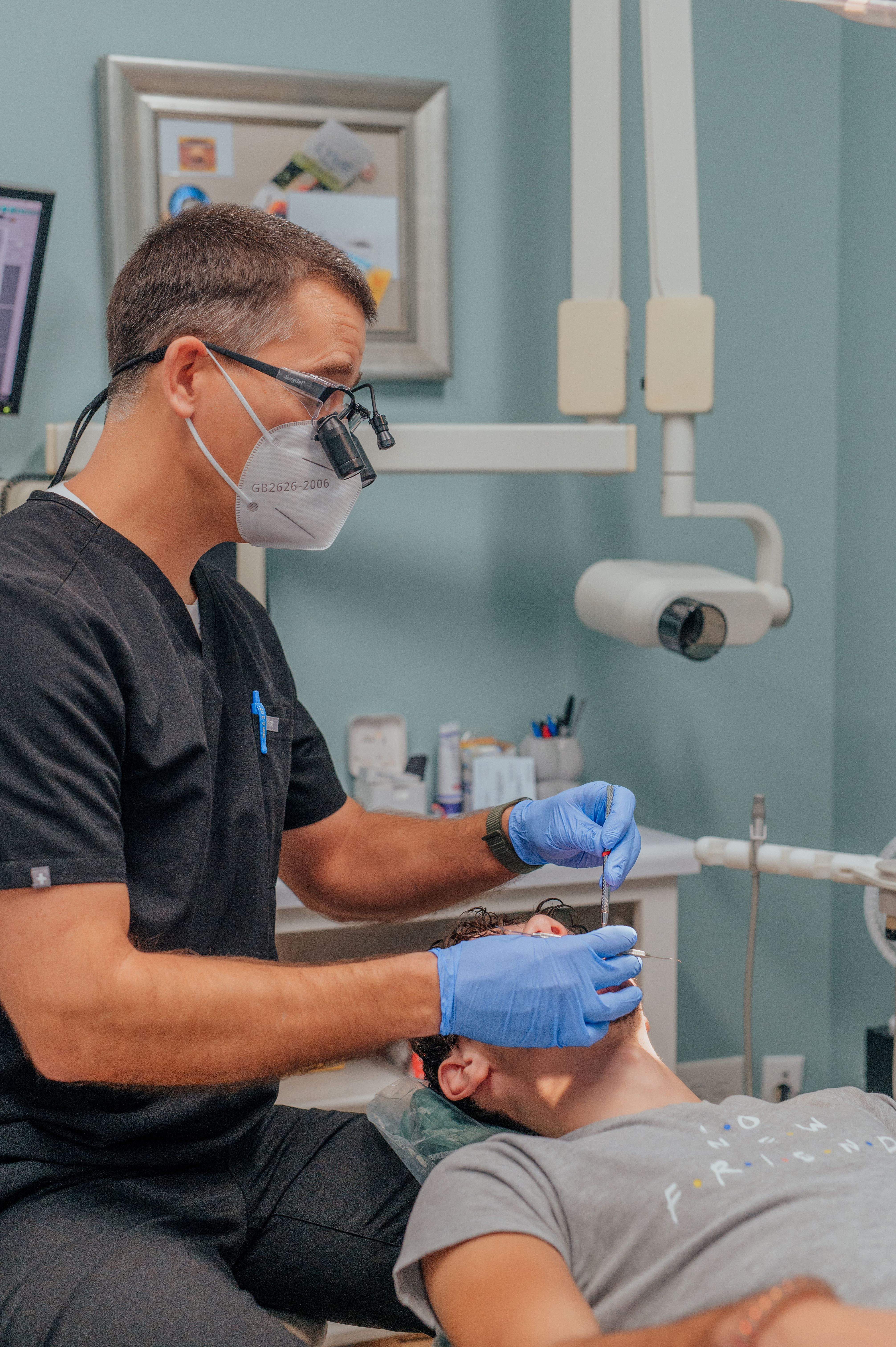 Dentist Dalton - Dr. Robison with dental patient